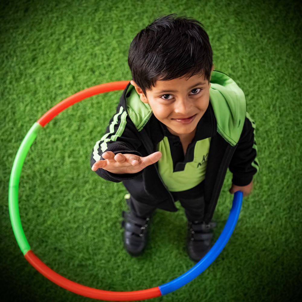 Students of Kaizen Kids playing with some rings